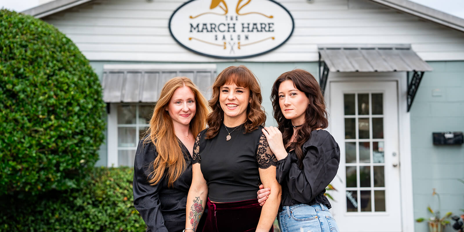 Hair stylist in front of march hare salon in fairhope, al